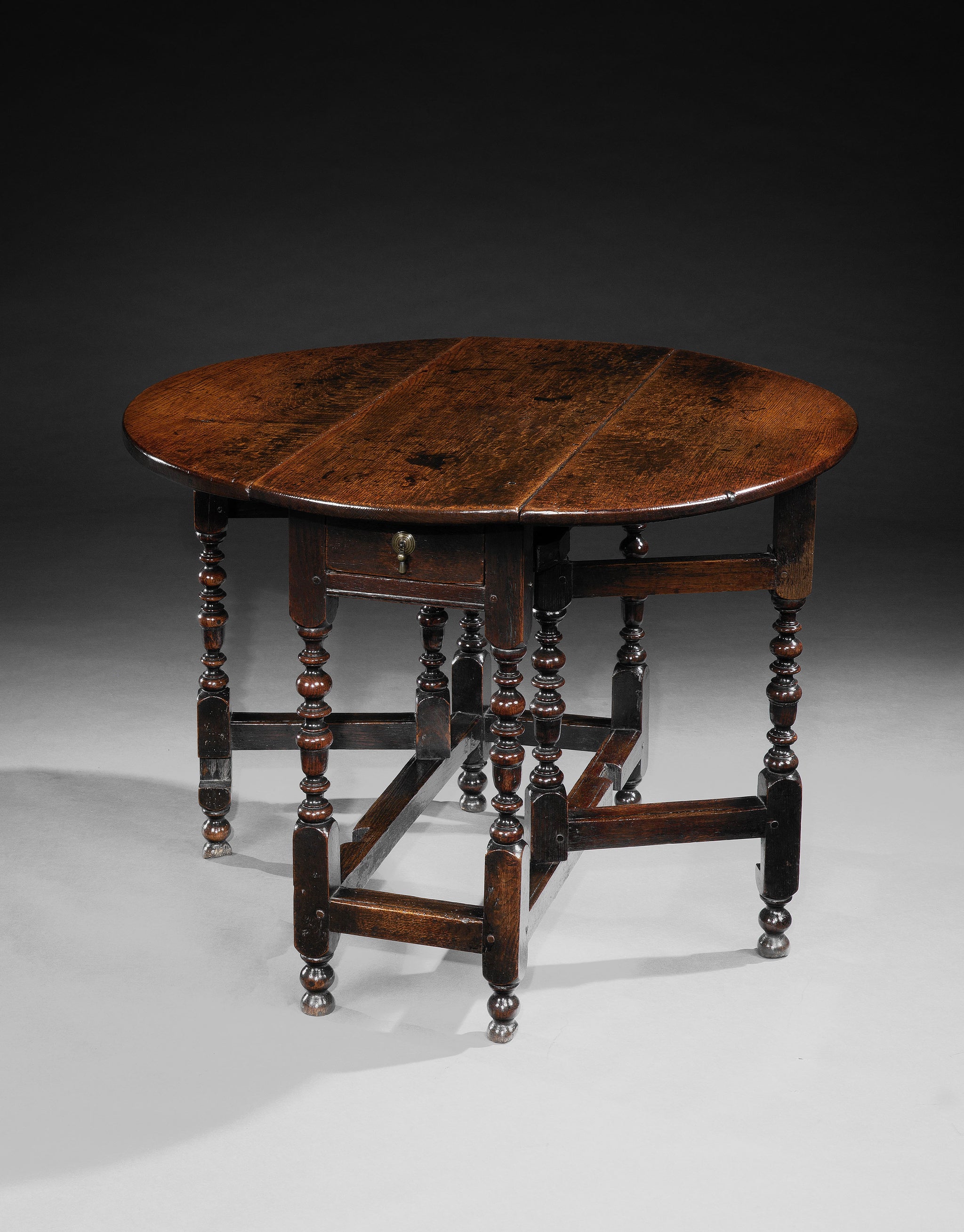 An Excellent William and Mary Oval Drop Leaf Table