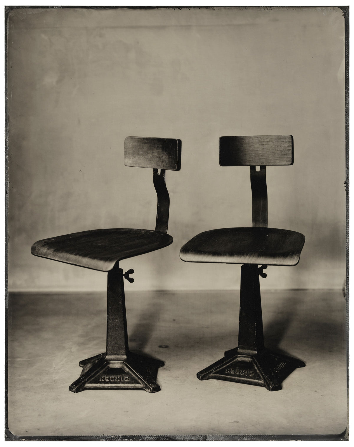 “Two Singer Sewing Machine Chairs”