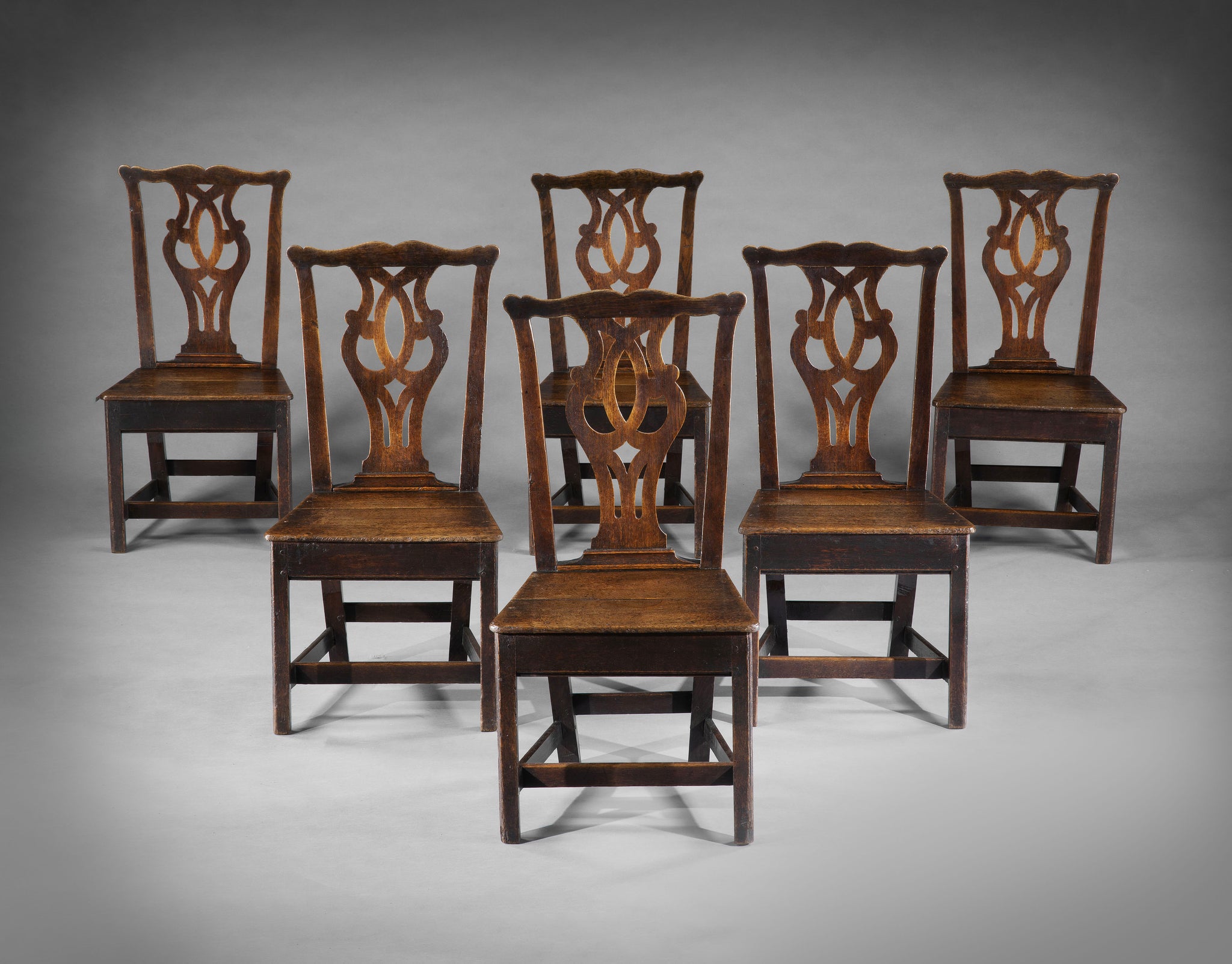 A Striking Set of Six "Country Chippendale" Chairs