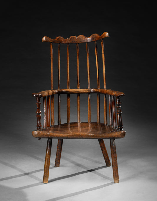An Exceptional Primitive Comb Back Armchair