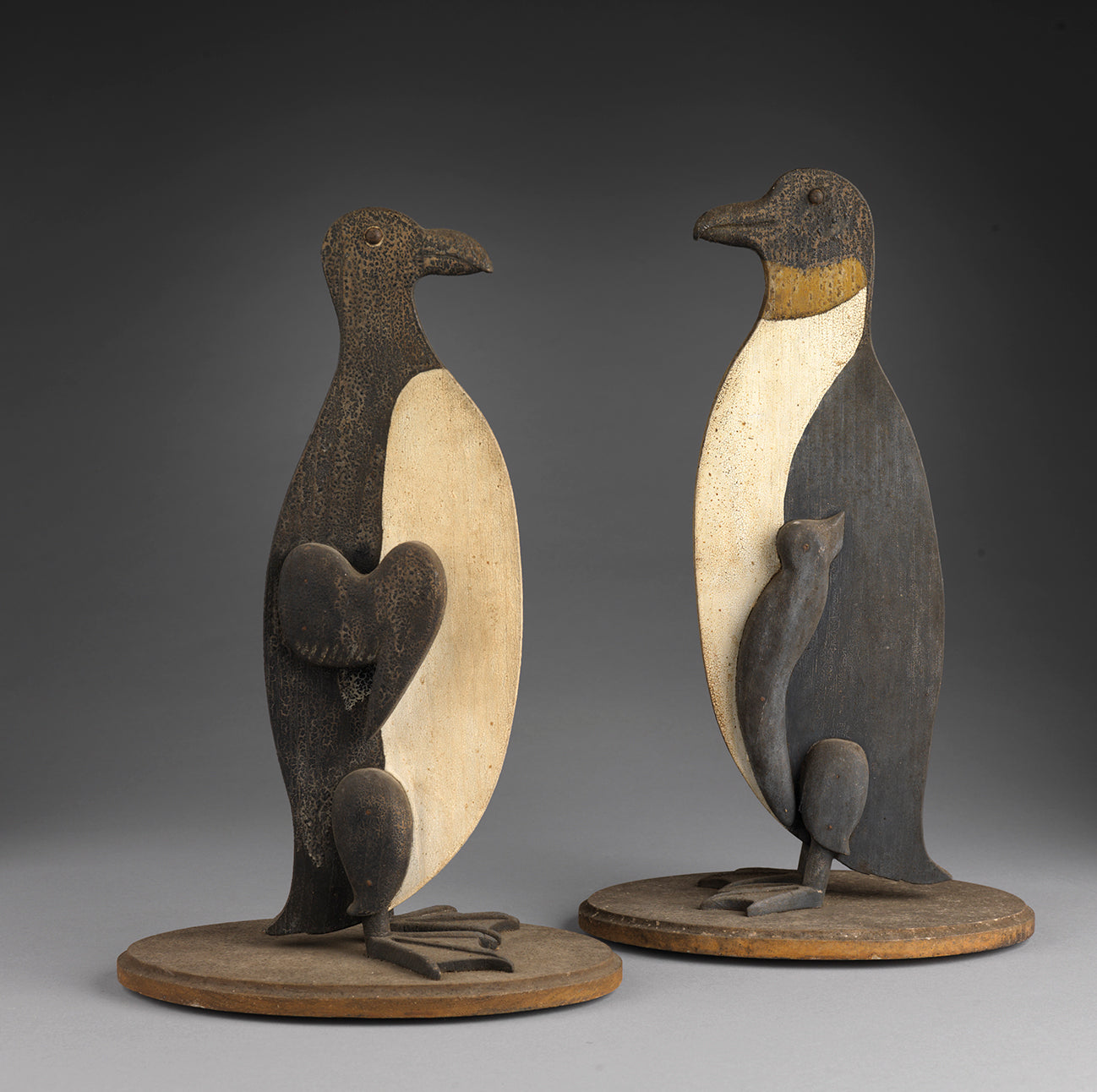 Engaging Pair of Primitive Silhouette Penguins