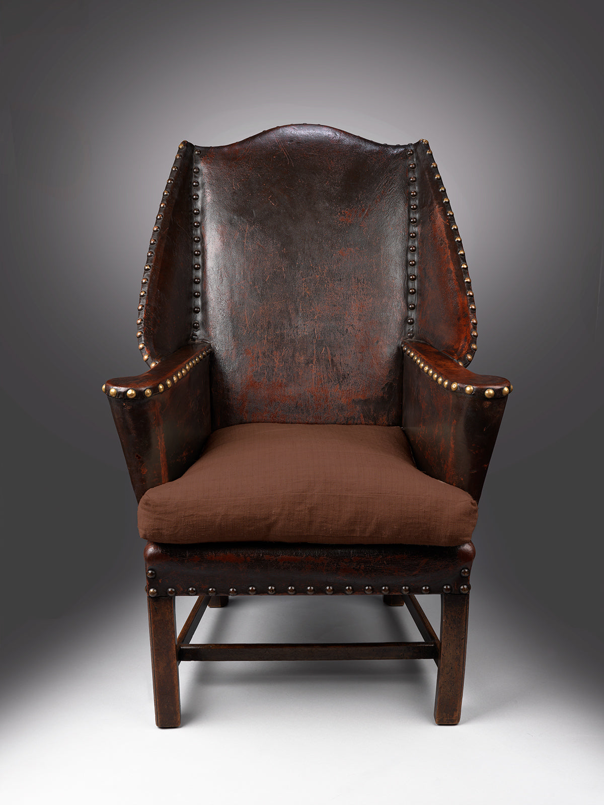 Georgian Style Leather Upholstered Wing Armchair