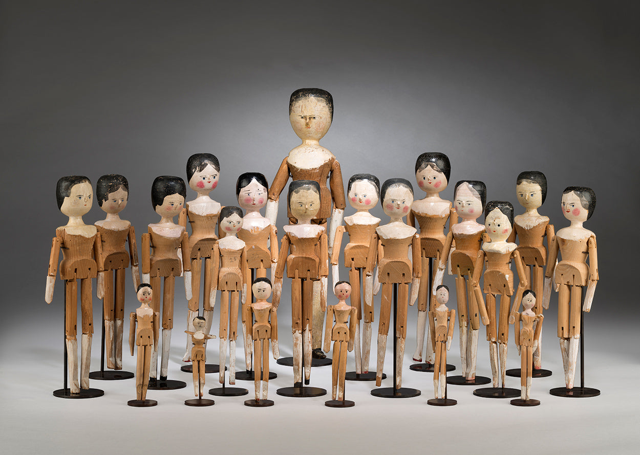 An Engaging Collection of 21 Primitive "Peg" Dolls