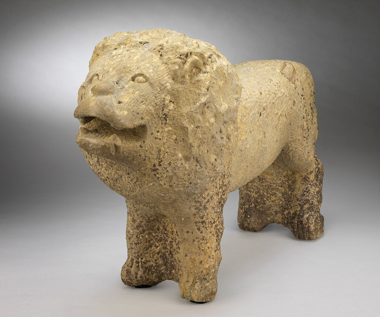 A Powerful Primitive Folk Art Sculpture of a Standing Lion