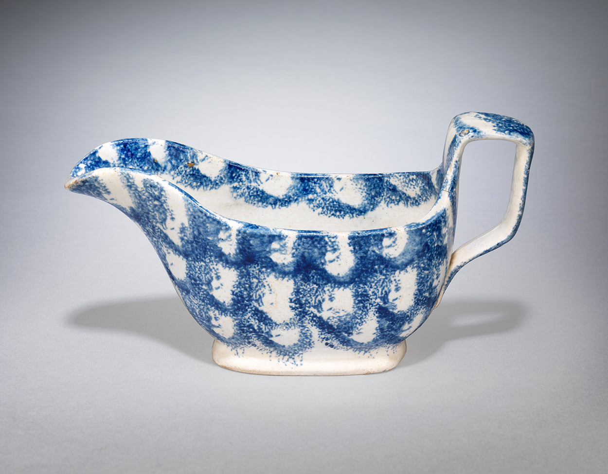 A Rare and Early Spongeware Sauce Boat of Classic Form with Fine Sponged Decoration