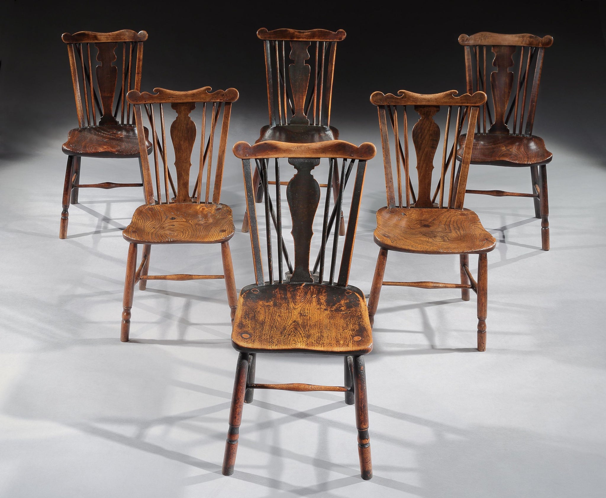 A Good Matched Set of Six Early Comb Back Windsor Chairs