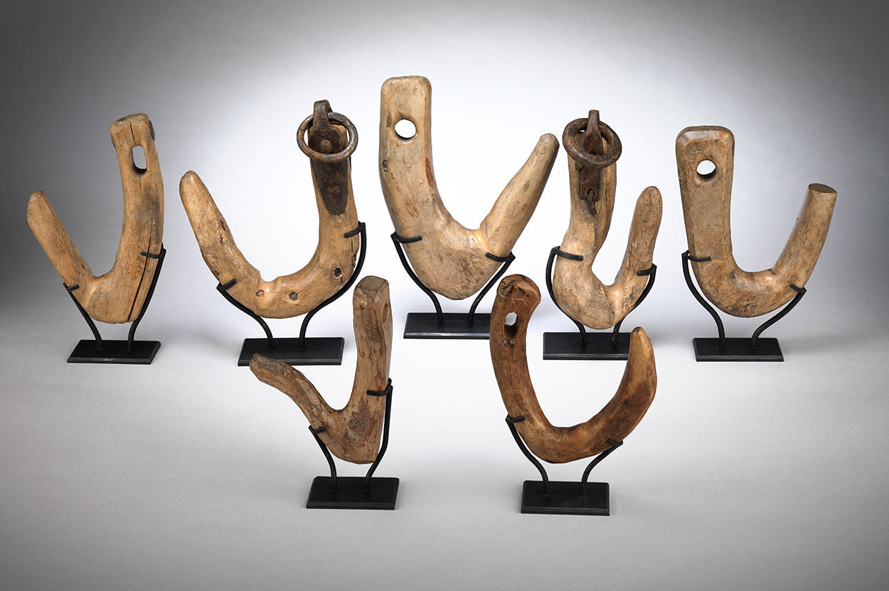 Collection of Seven Sculptural Wooden Folk Art Pulley Hooks