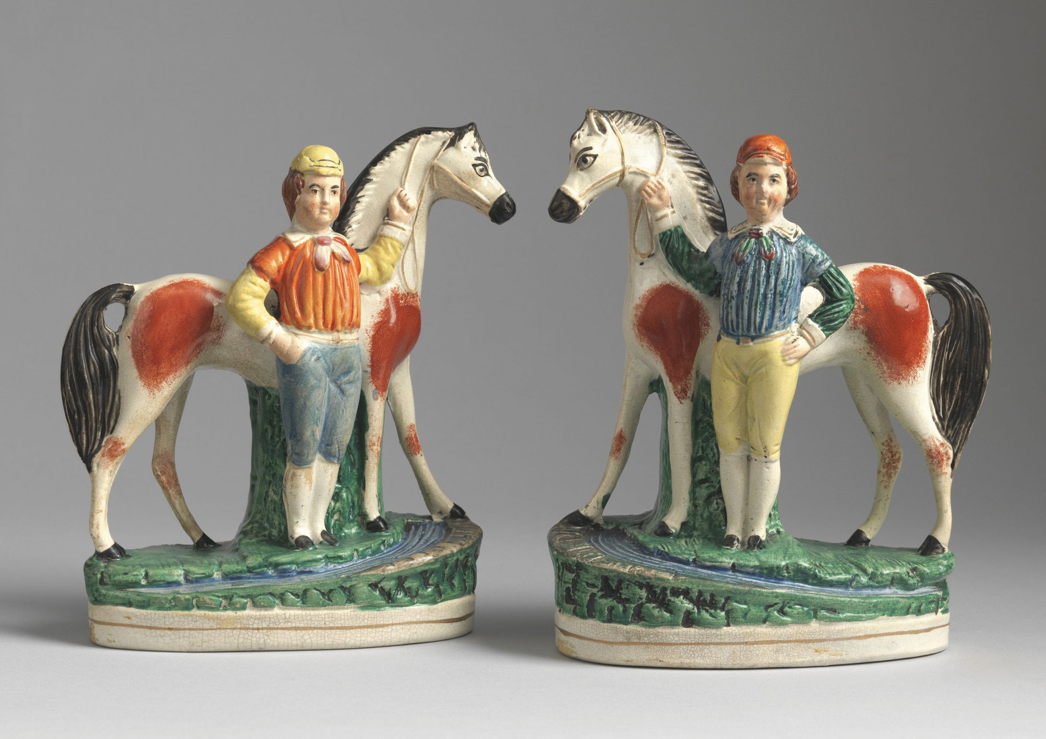 A Pair of Primitive Equestrian Figures