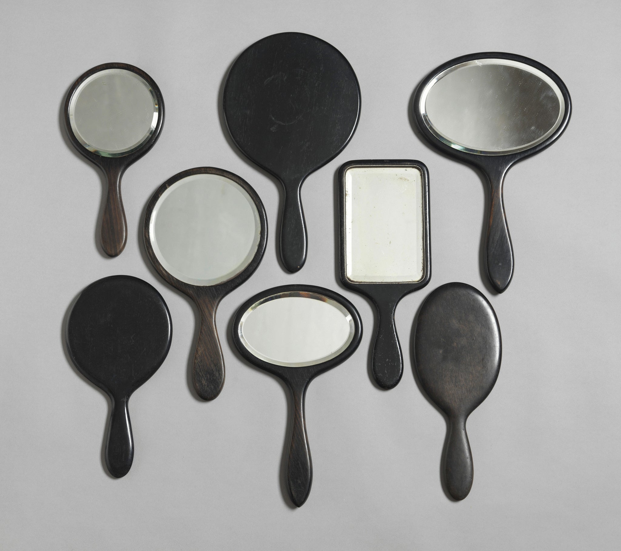 A Selected Group of Eight Vintage Hand Held Vanity Mirrors