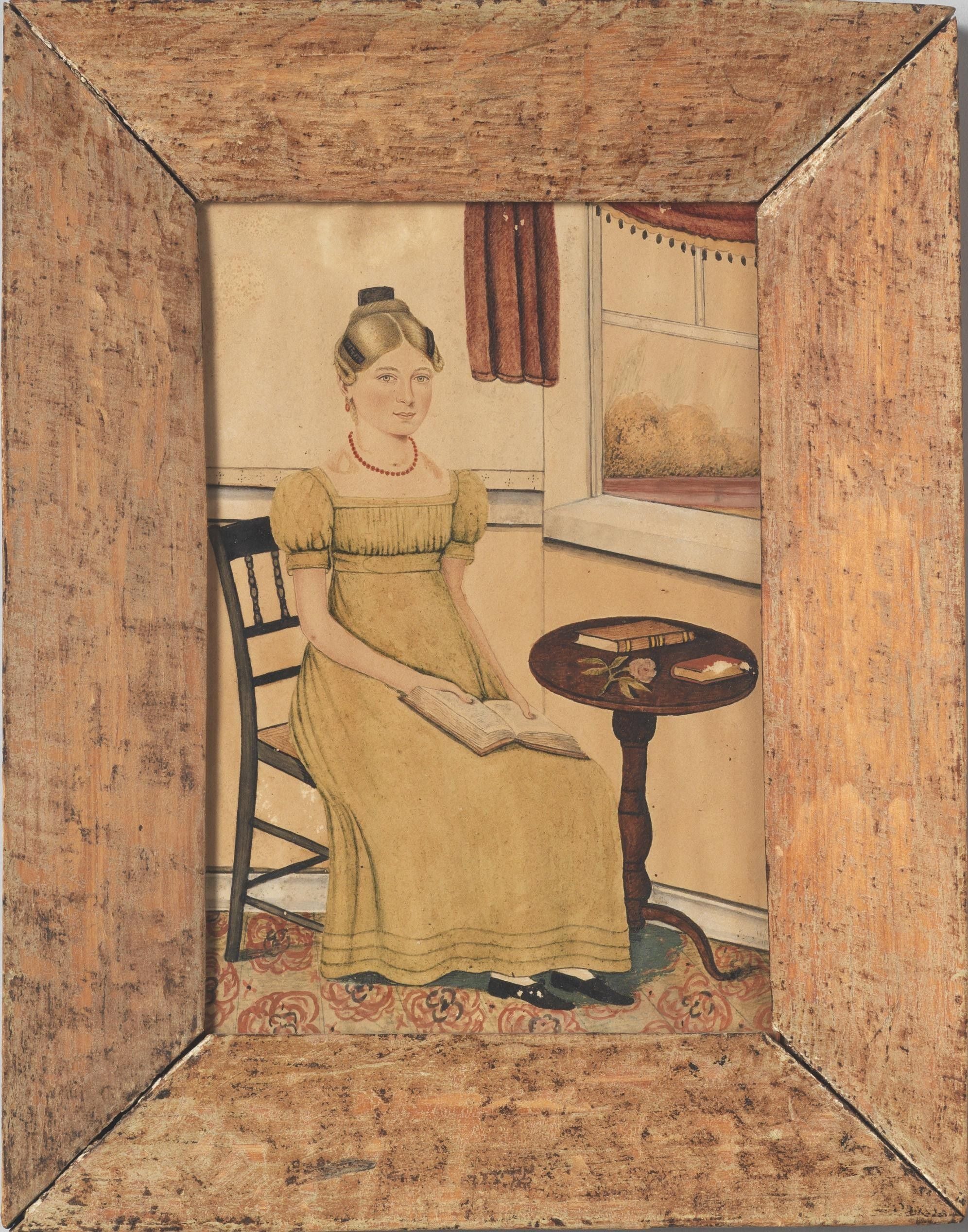 Seated Girl Reading At A Table