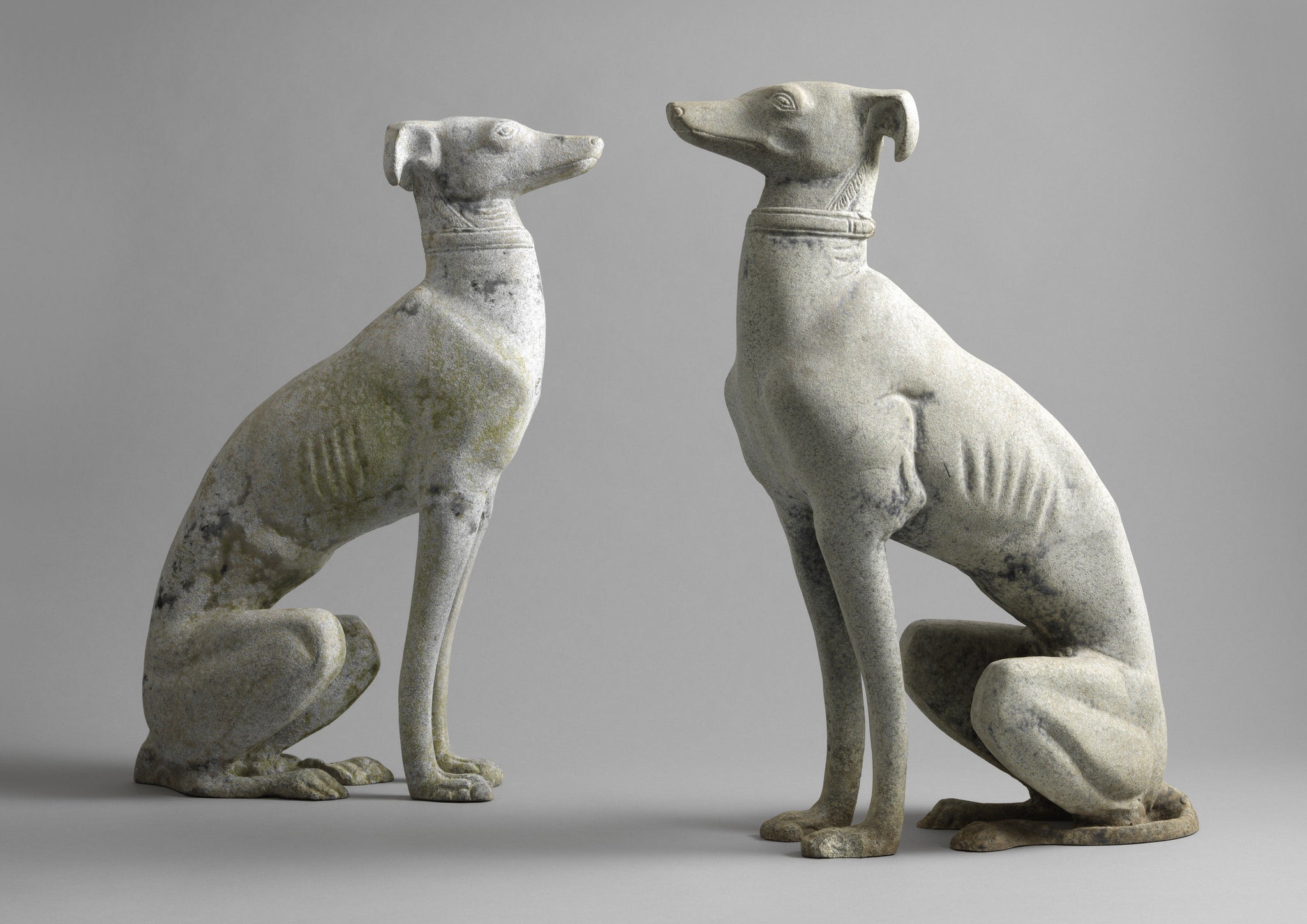 A Pair Of Seated Greyhounds
