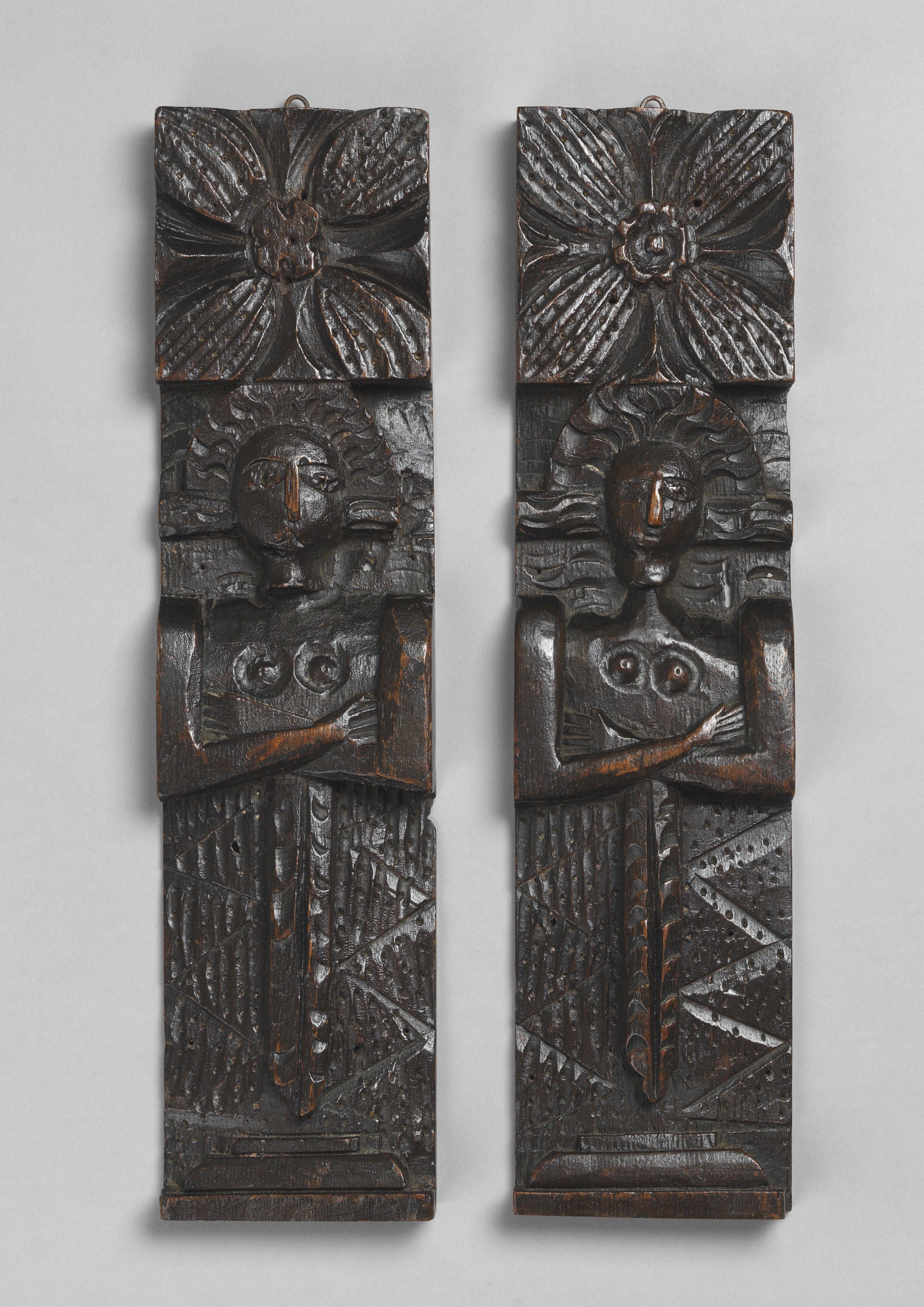 Pair of Primitive Figure Carved Terms or 'Caryatids'