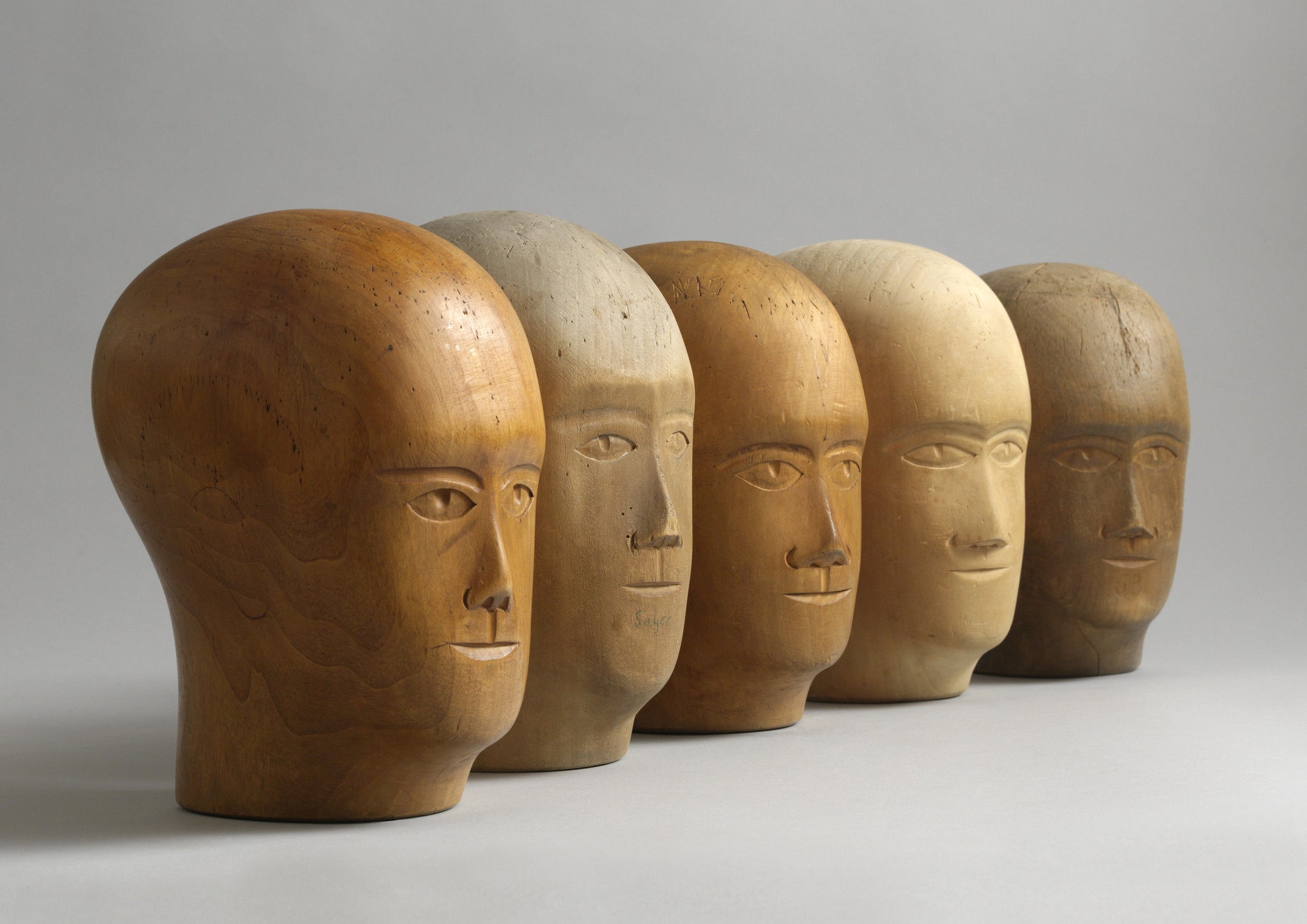 A Group of Five Head Form Milliner's Lasts