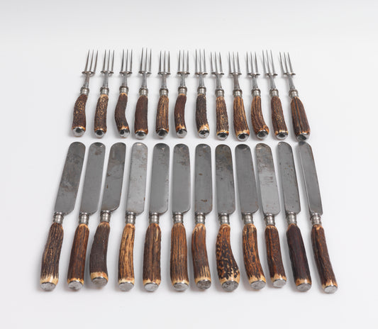 A Full Set of Twelve Stags Horn Handled Knives and Forks
