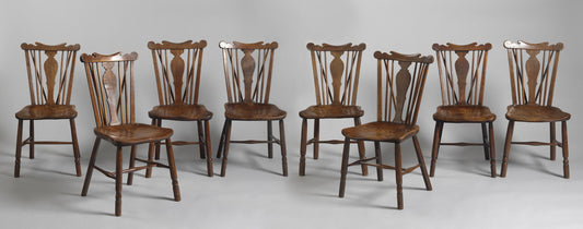 A Fine Matched Set of Eight Comb Back Windsor Dining Chairs