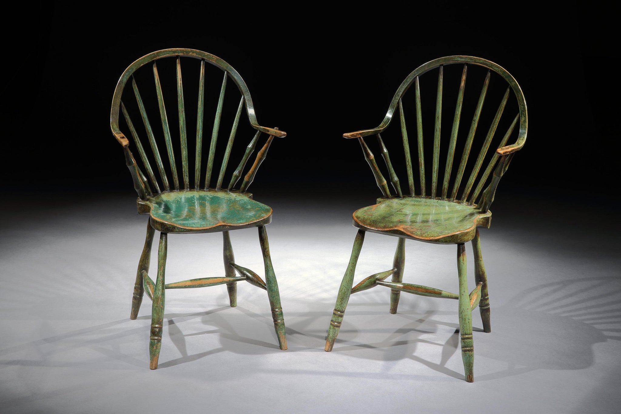 Iconic Pair of "Yealmpton" Continuous Arm Windsor Chairs
